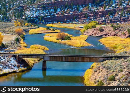 Landscape with autumn trees and river. Rocky Mountains, Colorado, USA. 