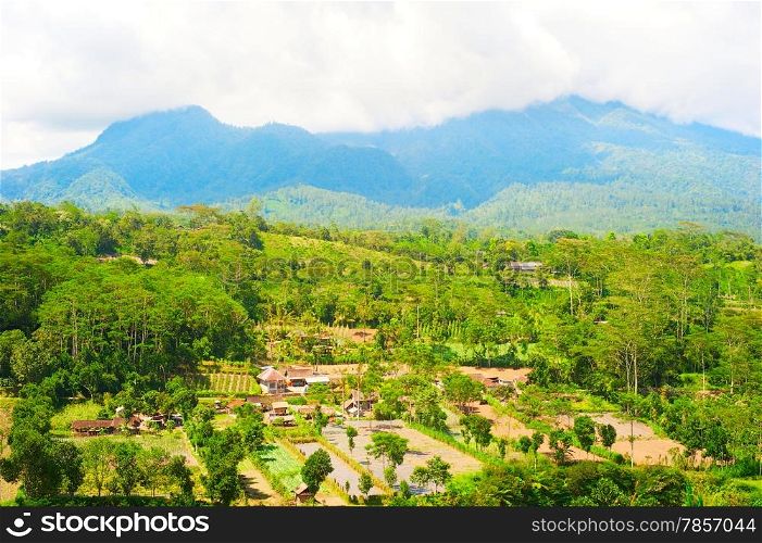 Landscape with Balinese village and mountains. Bali island, Indonesia