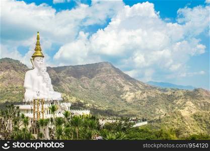Landscape with Buddha statue in the country in Thailand during the day.
