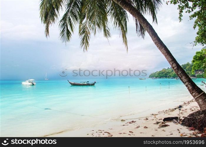 Landscape With Coconut Palms And Boat In Blue Sea Southern Of Thailand, Lipe Island, Krabi.
