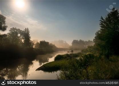 Landscape with moon light at night over river. Fog above water and trees