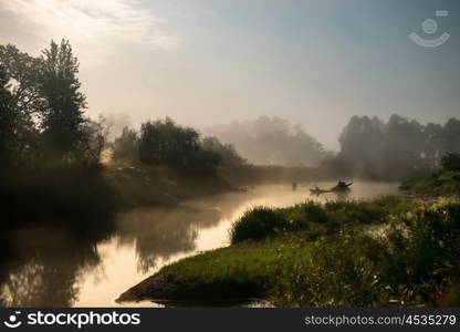 Landscape with moon light at night over river. Fog above water and trees