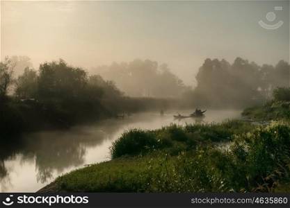 Landscape with moon light at night over river. Fog above water and trees