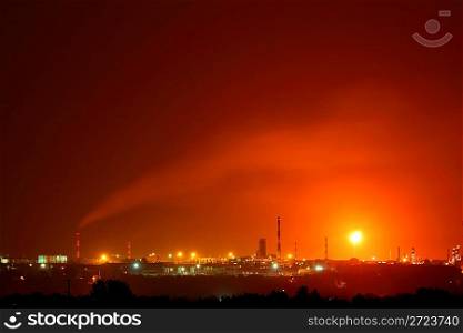 landscape with petrochemical factory with flame at night