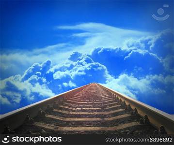 landscape with rails going away into the blue cloudy sky. landscape with rails going away into the blue cloudy sky. Cloudy landscape