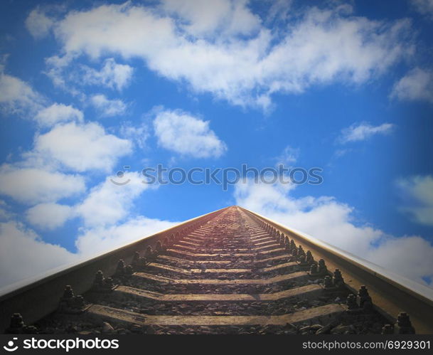 landscape with rails going away into the blue cloudy sky. landscape with rails going away into the blue cloudy sky. Cloudy landscape