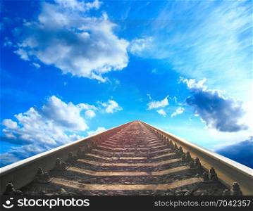 landscape with rails going away to the blue cloudy sky. landscape with rails going away to the blue cloudy sky. Cloudy landscape