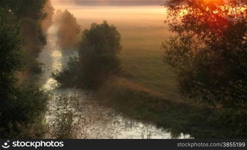 landscape with rising sun fog. HD time lapse.
