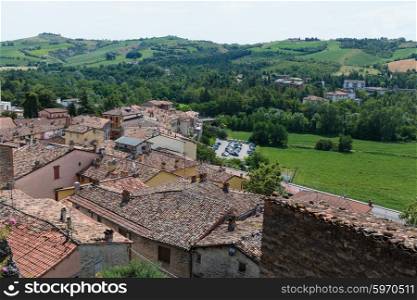 landscape with roofs of houses in small tuscan town in province, Italy