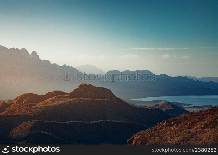 Landscape with sun rising over mountains and a bay near Loreto, Baja California, Mexico 