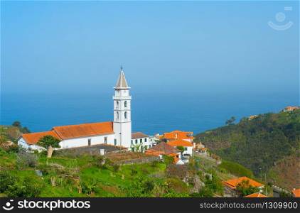 Landscape with village, church and ocean. Madeira island, Portugal