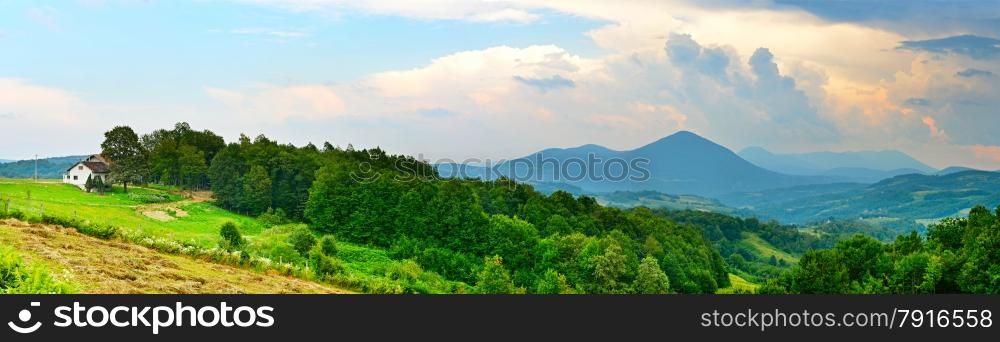 Landscape with white home, mountains and trees. Bosnia and Herzegovina