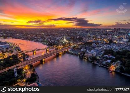Landscaped areas Buddha Yodfa Bridge is a bridge of communication between the capital of Thonburi in Bangkok at twilight, dramatic sky.. River of Life