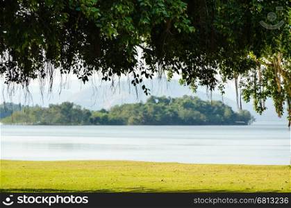 Landscaped lawns for relaxing waterfront under the tree at Kaeng Kra Chan National Park in Phetchaburi Province, Thailand