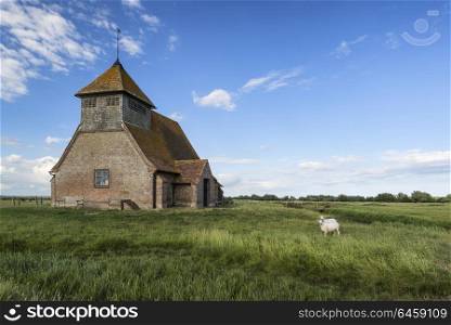 Landscapes. Ancient 13th Century derelict church in blue sky Summer landscape