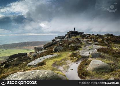 Landscapes. Hikers in Peak District during autumn sunset.