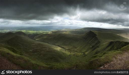 Landscapes. Landscape view from Pen y fan peak in Brecon Beacons with dark dramatic stormy sky