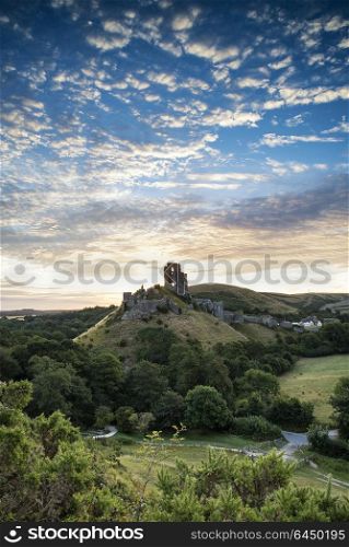 Landscapes. Old medieval castle ruins in Summer sunrise landscape image