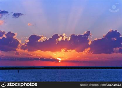 Lanscape evening calm sea with purple sunset. Evening calm sea with purple sunset