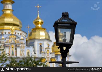 Lantern on a background St. Michael&rsquo;s cathedral in Kyiv, Ukraine .