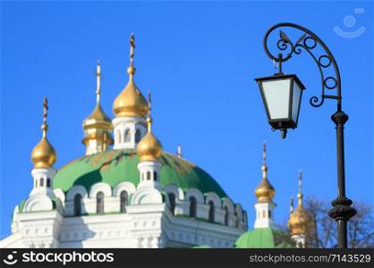 Lantern on the background of the Kiev Pechersk Lavra in Kyiv, Ukraine