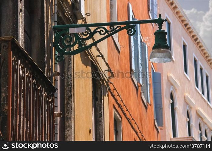 Lantern on the facade of old italian house. Venice