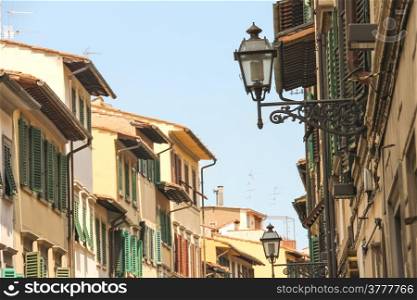 Lanterns on facades of the old houses in Florence, Italy