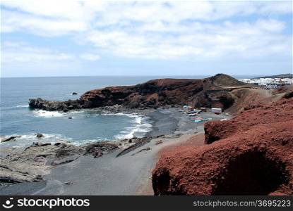 Lanzarote beach with volcanic landscape