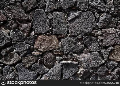 Lanzarote lava stone black masonry wall in Canary Islands