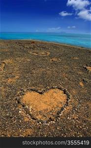 Lanzarote Papagayo and stones heart with Fuerteventura far away