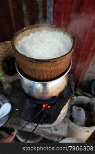 lao rice is cooking in a village near the city of Amnat Charoen in the Region of Isan in Northeast Thailand in Thailand.&#xA;