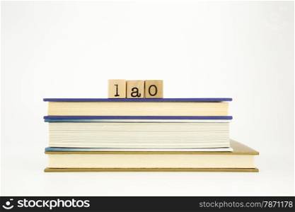 lao word on wood stamps stack on books, academic and language concept