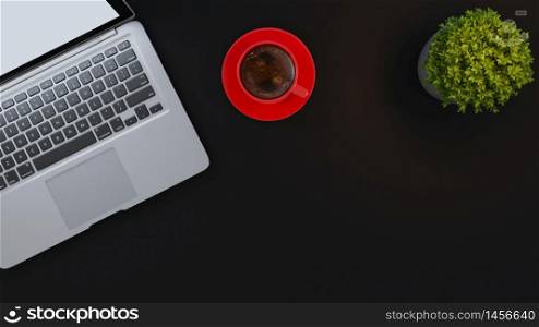Laptop and red cup and small plant on black desk background 3D rendering