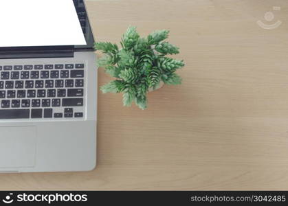 laptop blank screen on wooden table. computer laptop on table