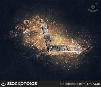 Laptop burning with fire. Concept of electronics break with device in fire flames