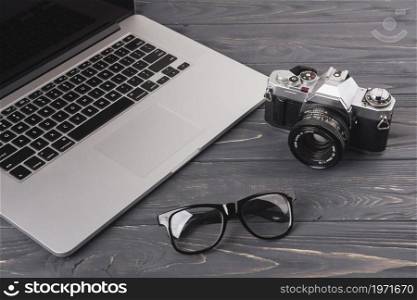laptop camera glasses table. High resolution photo. laptop camera glasses table. High quality photo