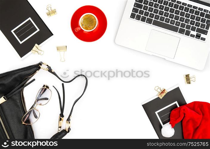 Laptop, coffee, books, christmas decoration on white background. Fashion flat lay for social media