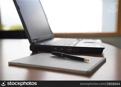 Laptop Computer and Notepad