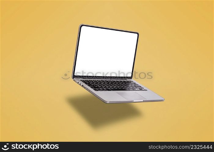 Laptop computer or notebook computer with blank screen isolated on yellow background