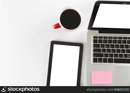 laptop computer, tablet and coffee cup on white background - top view
