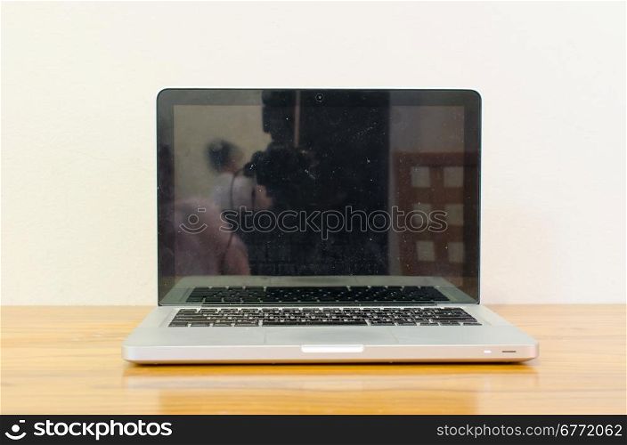 Laptop computer with blank white screen.