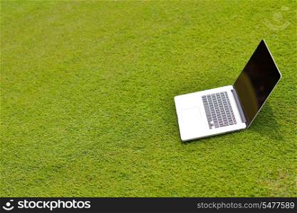laptop comuter on grass, freedom communication concetp and education and study