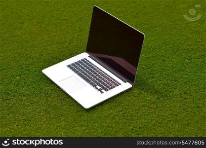 laptop comuter on grass, freedom communication concetp and education and study