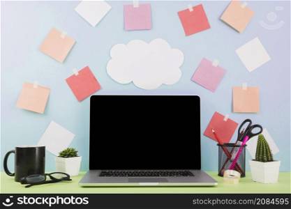 laptop front wall with cloud paper adhesive notes
