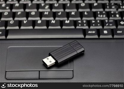 laptop keyboard and flash drive