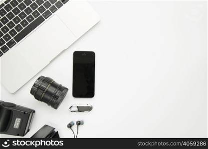 laptop near smartphone digital devices