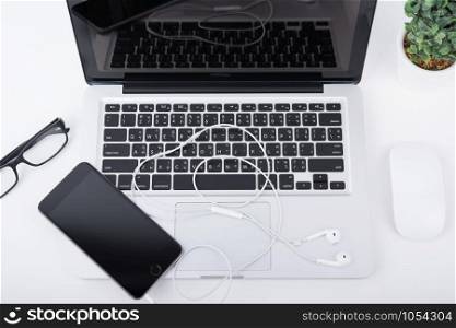 laptop,notebook and mobile phone, smartphone on office desk table.