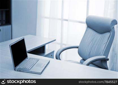 laptop on a desk of director at modern office