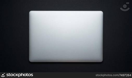 Laptop on black background,top view