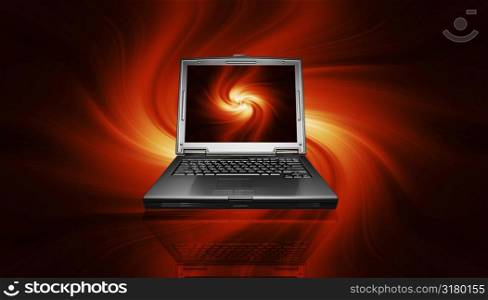 Laptop on fiery background